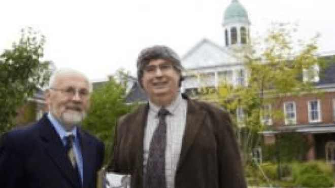 Two people standing together outdoors