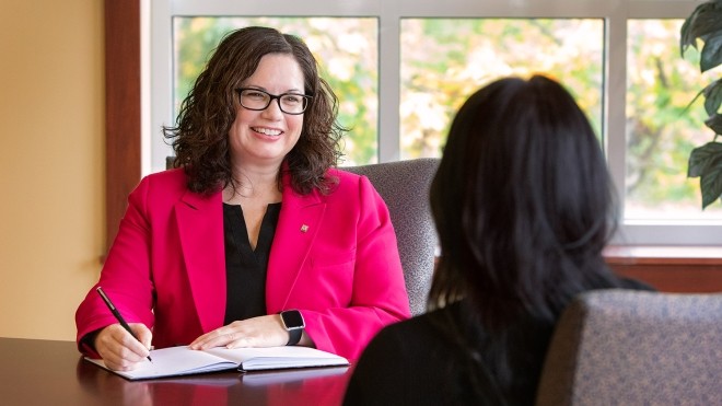 Photo of Bobbi Morrison talking to another person