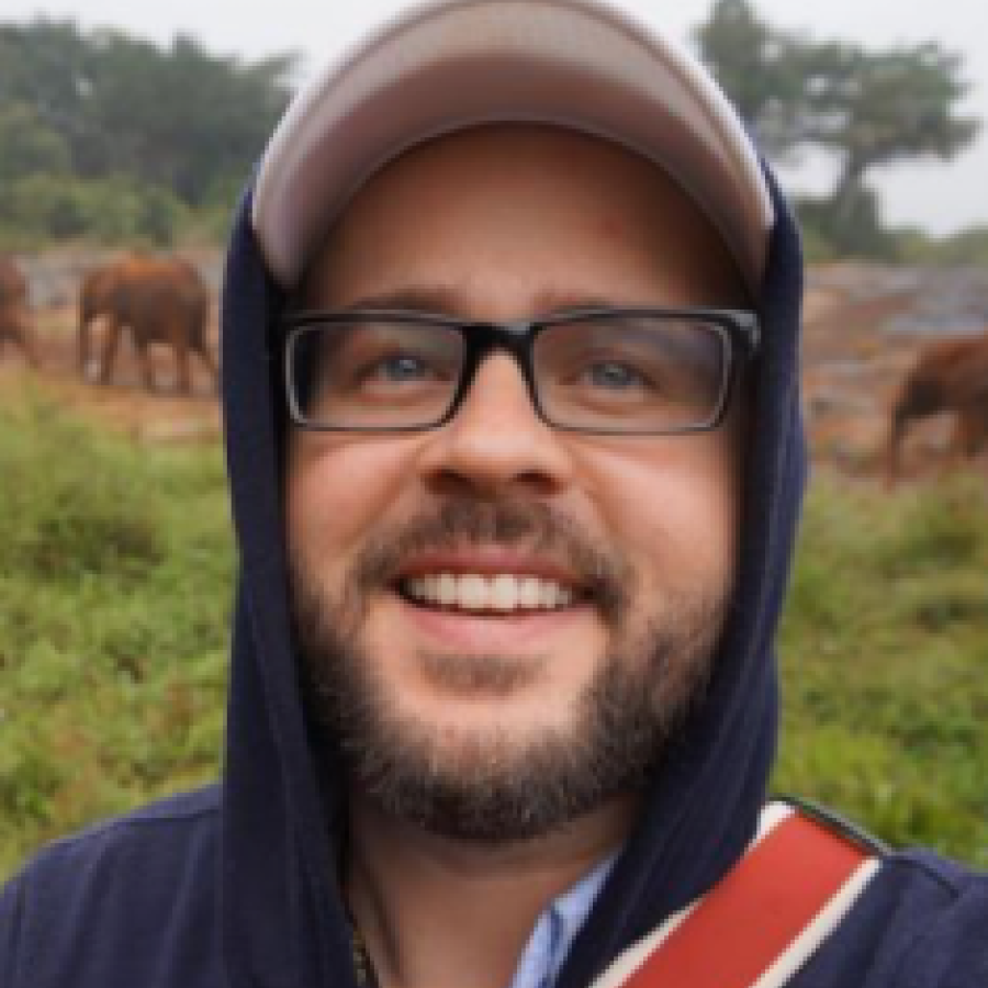 Headshot of a man outside 