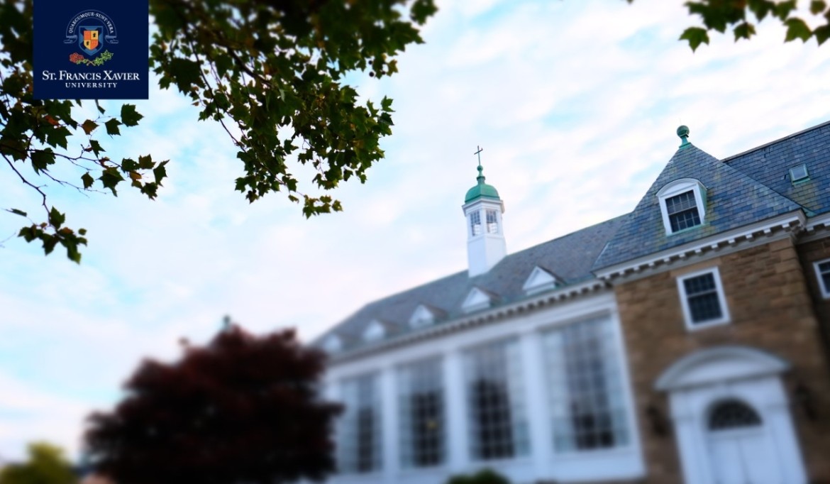 A large brick building with a clock tower&quot;