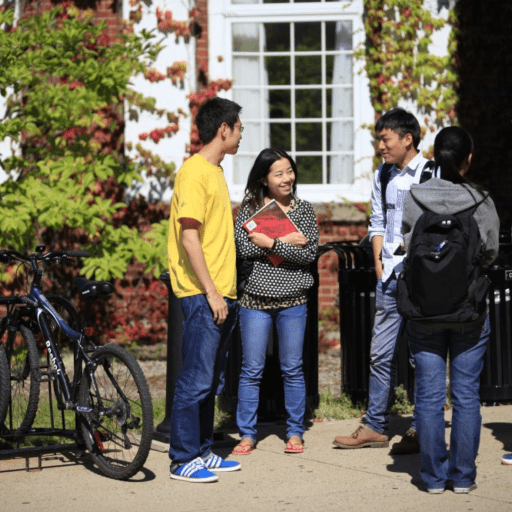 Fellow Students Talking Outside an University Building
