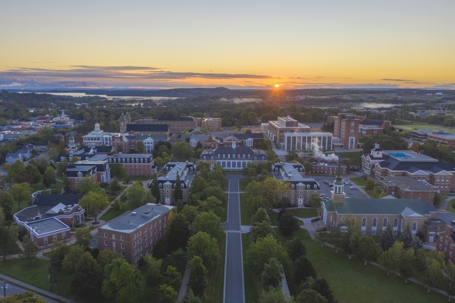 An aerial image of the StFX campus and the surrounding area at sunset. 