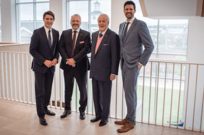 Group of people wearing suites in Mulroney Hall