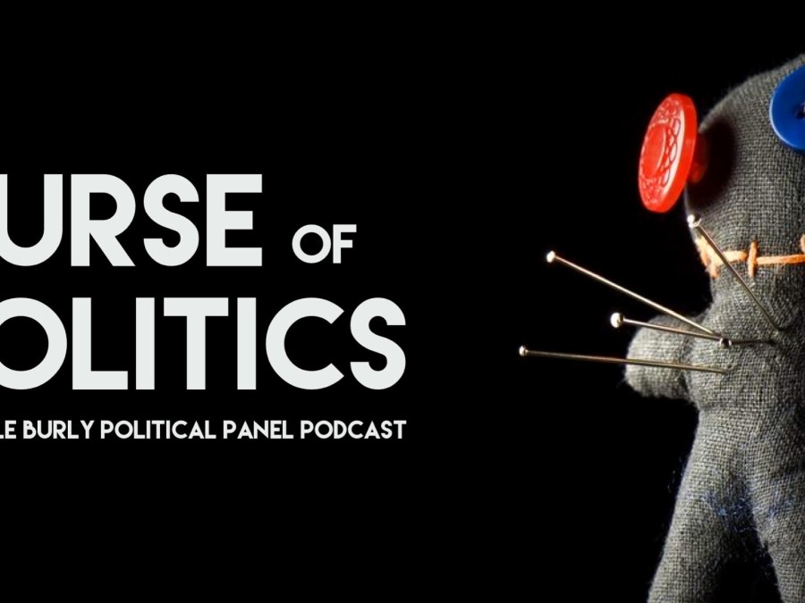 Text with a hand-sewn doll with button eyes and pins stuck in it.