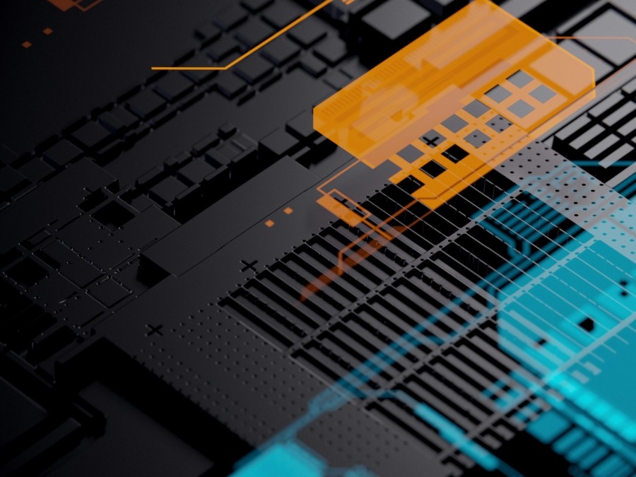 An internal view of a computer hard drive with chips coloured in orange and blue.