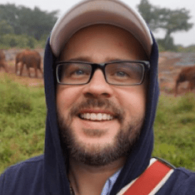 Headshot of a man outside 