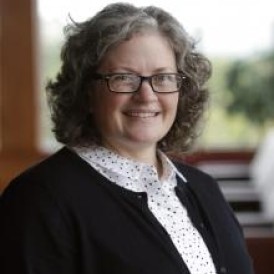 Headshot of Jane MacDonald smiling.